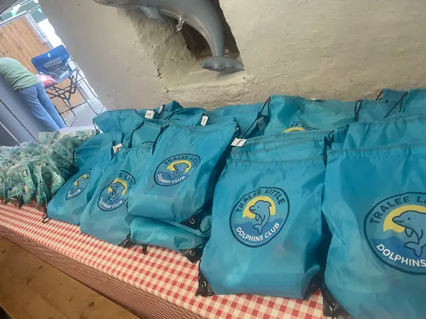 Rows of club goodie bags with the Tralee Little Dolphins badge