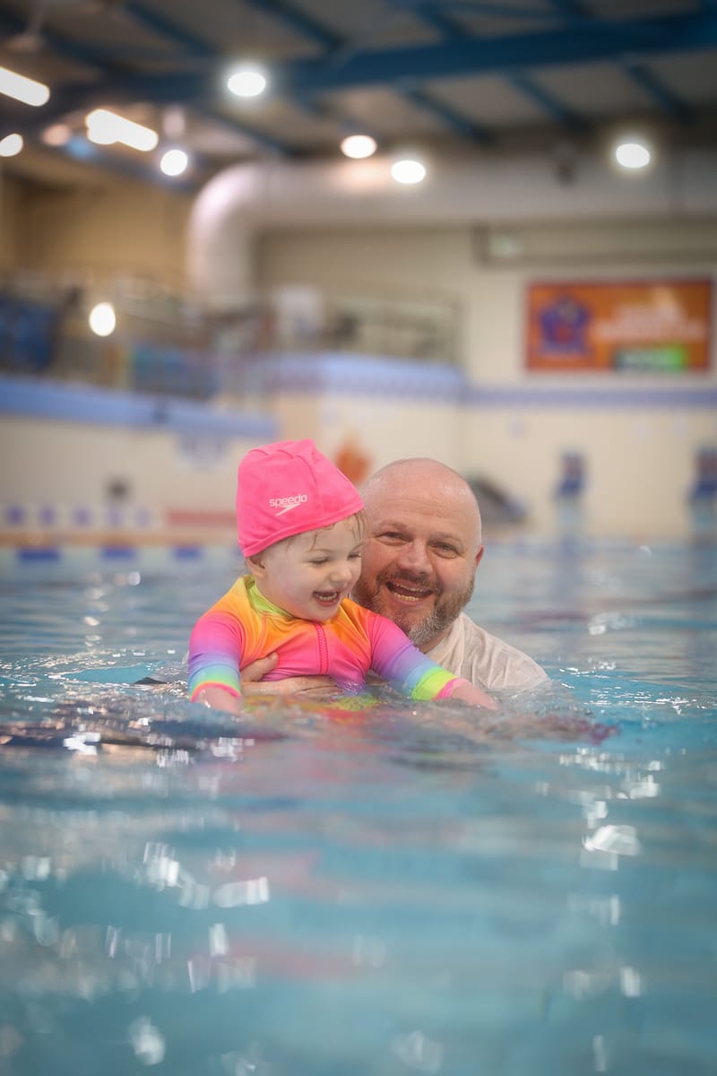 Brian in the pool with his daughter Sophia